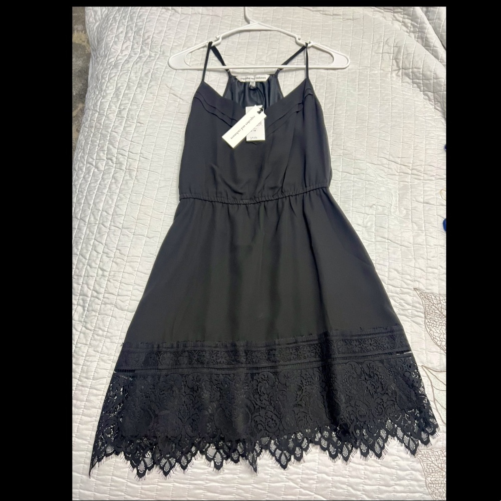 Adjustable spaghetti strap black dress with lace on bottom